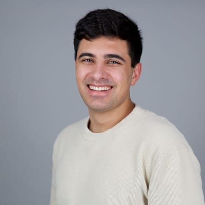 Edwin Dorsey, founder of The Bear Cave newsletter, smiling headshot on gray background